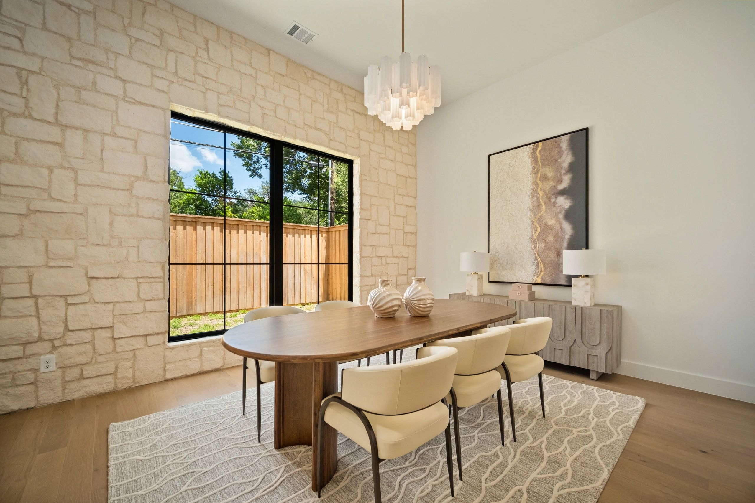 Dining room with natural light and elegant furnishings
