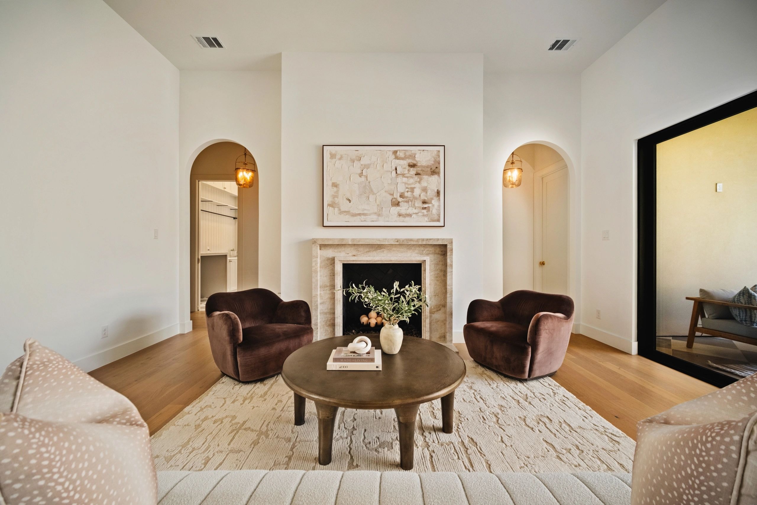 Living room with fireplace and warm neutral tones